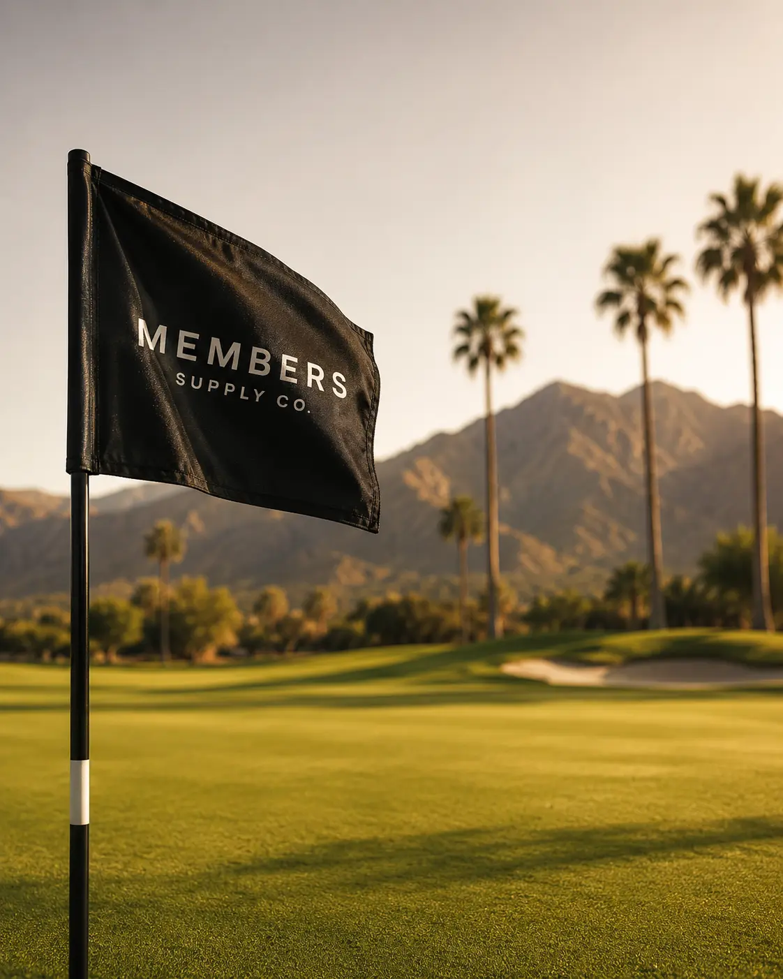 Members Supply Co. flag on a desert course at golden hour